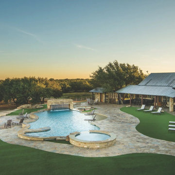Overhead view of resort style pool, flagstone decking and artificial turf