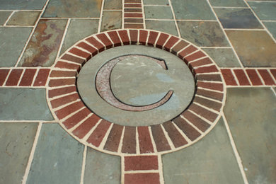 Design ideas for a patio in Other with natural stone pavers.