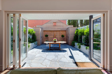 This is an example of a small country courtyard patio in Melbourne with no cover.