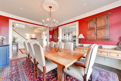 Mid-sized eclectic dark wood floor kitchen/dining room combo photo in New York with red walls