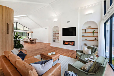 Design ideas for a contemporary living room in Central Coast with white walls.