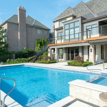 Burr Ridge Lap Pool with Raised Hot Tub and Waterfall