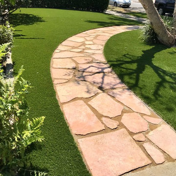 Frontyard artificial grass with flagstone walkway