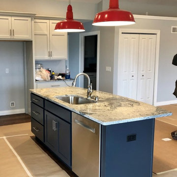 Blue Charcoal Island with Oyster Perimeter Koch Cabinets-White Wave Granite