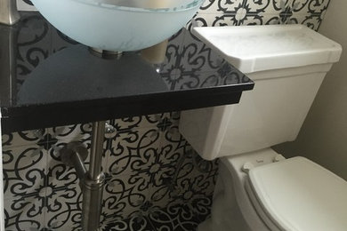 Design ideas for a transitional powder room in Austin.