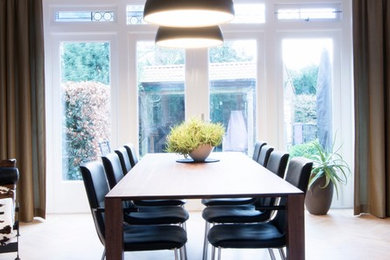 Example of a trendy dining room design in Amsterdam
