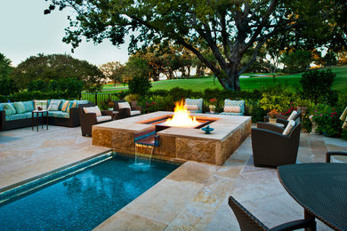 Photo of a mediterranean lap pool in Dallas with a water feature.