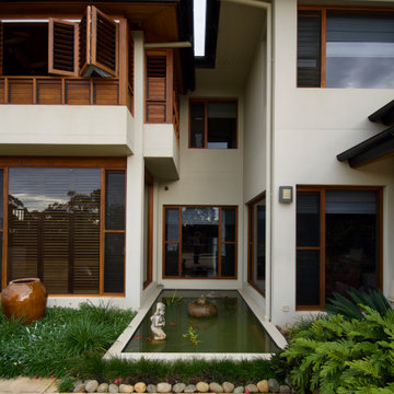 Home exteriors featuring Teal Timber Windows and Doors