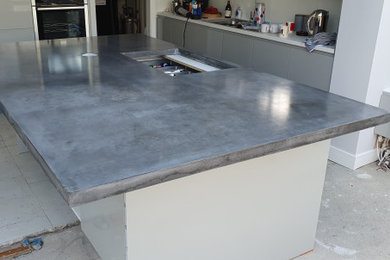 Inspiration for a contemporary kitchen in Kent with concrete worktops and grey worktops.