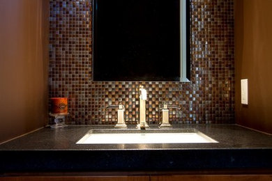 Bathroom - brown tile mosaic tile floor bathroom idea in San Diego with granite countertops and brown walls