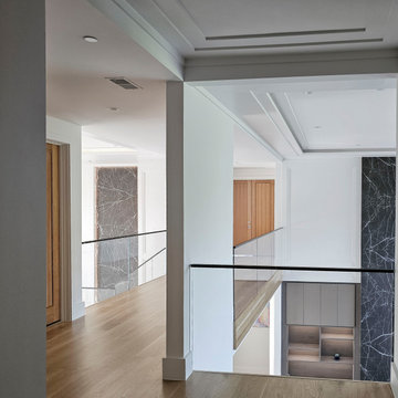 Project #107 | Freestanding Staircase with Marble Backdrop