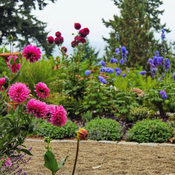 Flowering garden border with gravel path