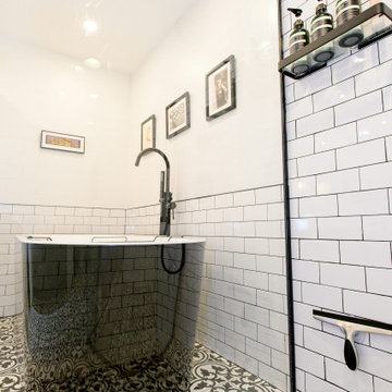 Black Freestanding Tub Viewed Through the Glass Shower | Downtown Toronto