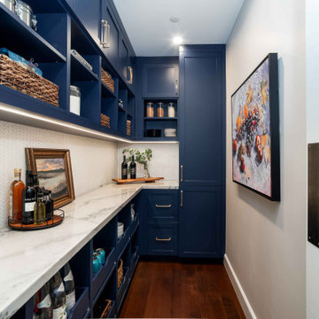 San Diego Walk-In Pantry with Navy Cabinets, Open Shelving, and Quartz Counterto