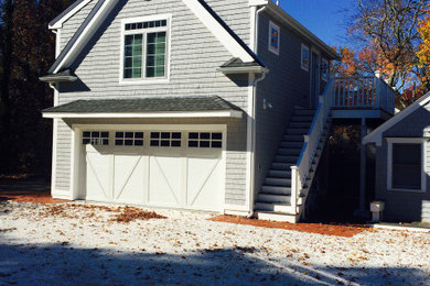 Huge beach style two-car garage workshop photo in Boston