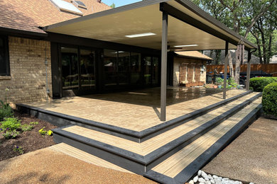 Deck skirting - large modern ground level deck skirting idea in Dallas