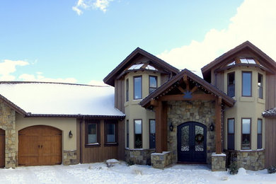 Example of a large mountain style brown three-story concrete fiberboard exterior home design in Phoenix