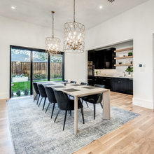 shelves match table, dark color with light backsplash
