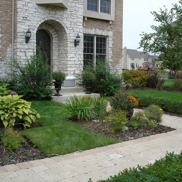 Formal paver patio gardens