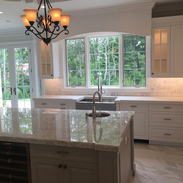 Expansive White Kitchen with Wrought Iron Detailing