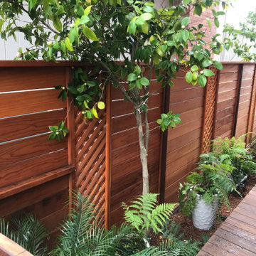 Clear horizontal 1x6 redwood fence with intervals of 12 inch redwood lattice