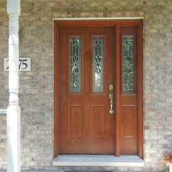 Wooden Entry Door on a Brick Exterior Home - Front Doors