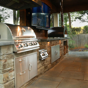 Luxury Outdoor Kitchen with Built-In Grill, Pizza Oven & Entertainment Area