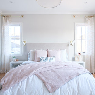 Bedroom - transitional medium tone wood floor and brown floor bedroom idea in San Francisco with beige walls