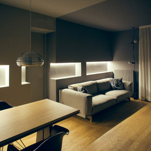 Small modern kitchen pantry designs - Inspiration for a small modern single-wall ceramic floor kitchen pantry remodel in Milan with flat-panel cabinets, light wood cabinets, solid surface countertops, white backsplash and stainless steel appliances