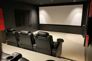 Design ideas for a mid-sized modern home theatre in Melbourne.