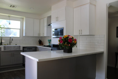 Example of a mid-sized mid-century modern u-shaped kitchen pantry design in Los Angeles with shaker cabinets, white cabinets, quartz countertops, a peninsula and yellow countertops