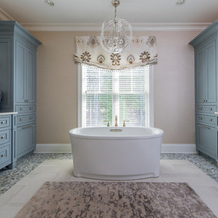 Inspiration for a transitional multicolored floor freestanding bathtub remodel in Cleveland with beaded inset cabinets and blue cabinets