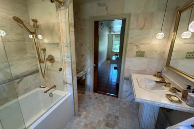 Bathroom - mid-sized contemporary master marble tile marble floor and single-sink bathroom idea in Philadelphia with a bidet, a pedestal sink, marble countertops, a niche and a freestanding vanity