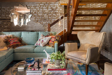 Example of an eclectic living room design in Charleston with green walls