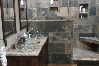 Bathroom - mid-sized craftsman 3/4 gray tile and slate tile light wood floor and beige floor bathroom idea in Other with shaker cabinets, dark wood cabinets, beige walls, a vessel sink, granite countertops and beige countertops