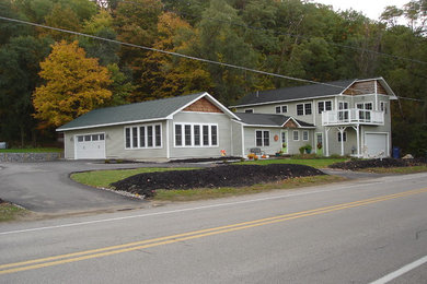 Inspiration for a mid-sized timeless attached two-car garage remodel in Other