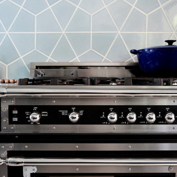 Stovetop with Blue Hex Tiles Backsplash