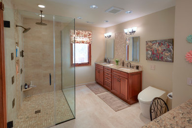 Walk-in shower - huge master porcelain tile walk-in shower idea in Chicago with raised-panel cabinets, light wood cabinets, a bidet, an undermount sink and quartz countertops