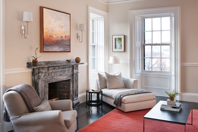 Photo of a contemporary living room in Boston with beige walls, a standard fireplace and no tv.
