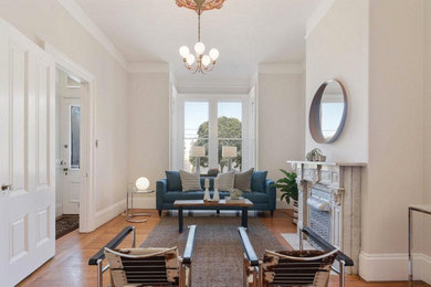 Inspiration for a large formal living room in London with a standard fireplace.