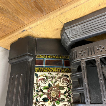 Genuine Reclaimed Victorian Cast Iron Fireplace With Hand Painted Tile Inserts.