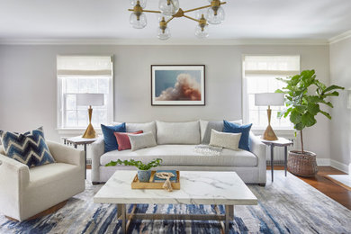 Photo of a large transitional open concept family room in New York with a wall-mounted tv.