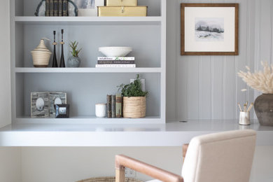 Study room - mid-sized transitional built-in desk light wood floor and beige floor study room idea in Orange County with gray walls