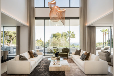 Trendy beige floor living room photo in Other with white walls
