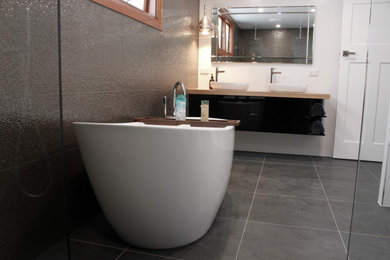 Large modern bathroom in Brisbane with a floating vanity.
