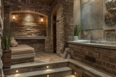 Design ideas for a large bohemian fully buried basement in London with brown walls, slate flooring, brown floors, a timber clad ceiling and a feature wall.