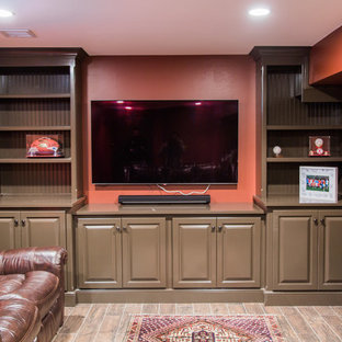 Inspiration for a large traditional fully buried basement in Boston with red walls, laminate floors, no fireplace and brown floors.