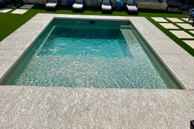 Inspiration for a small modern backyard concrete and rectangular natural pool landscaping remodel in Austin