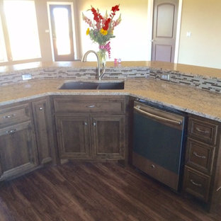 Mid-sized eclectic kitchen pantry photos - Kitchen pantry - mid-sized eclectic kitchen pantry idea in Little Rock with an undermount sink, recessed-panel cabinets, dark wood cabinets, laminate countertops, beige backsplash, glass tile backsplash, stainless steel appliances and an island
