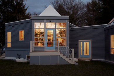 Mid-sized modern gray one-story vinyl exterior home idea in Boston
